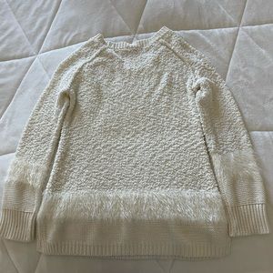 White long sleeve chenille sweater with faux fur details.